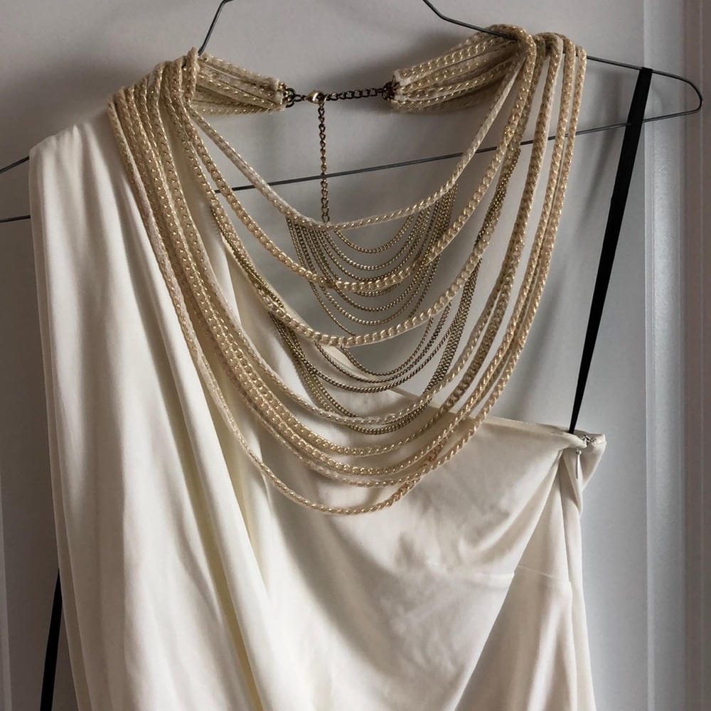 Cream colored dress necklace attached